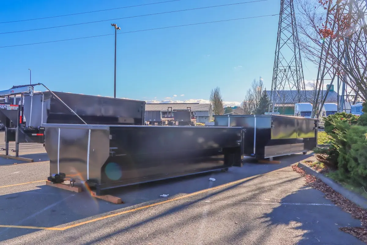 Roll-off dumpster ready for waste disposal at job site for Demolition Dumpster Rental in North East